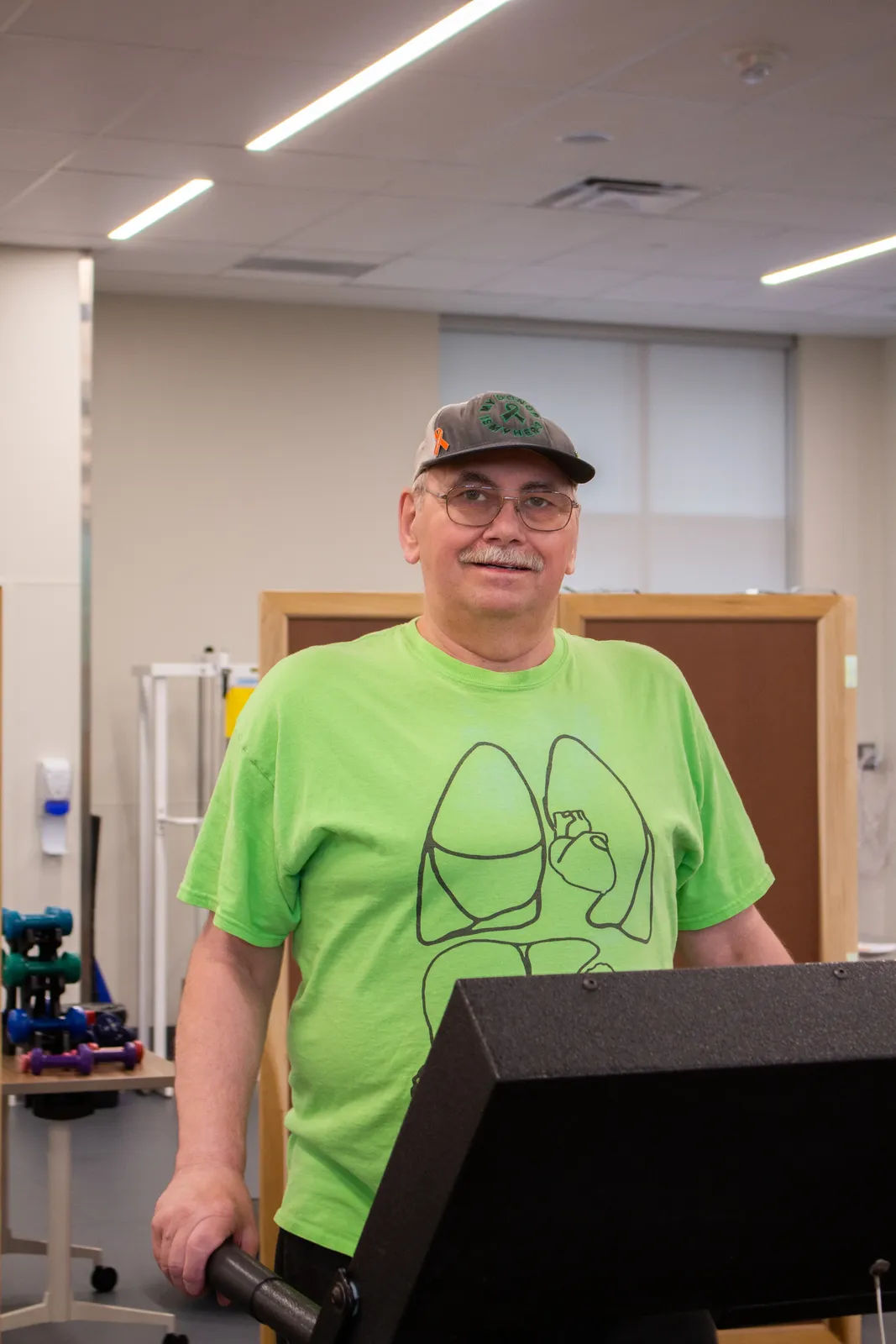 smiling man in green t-shirt
